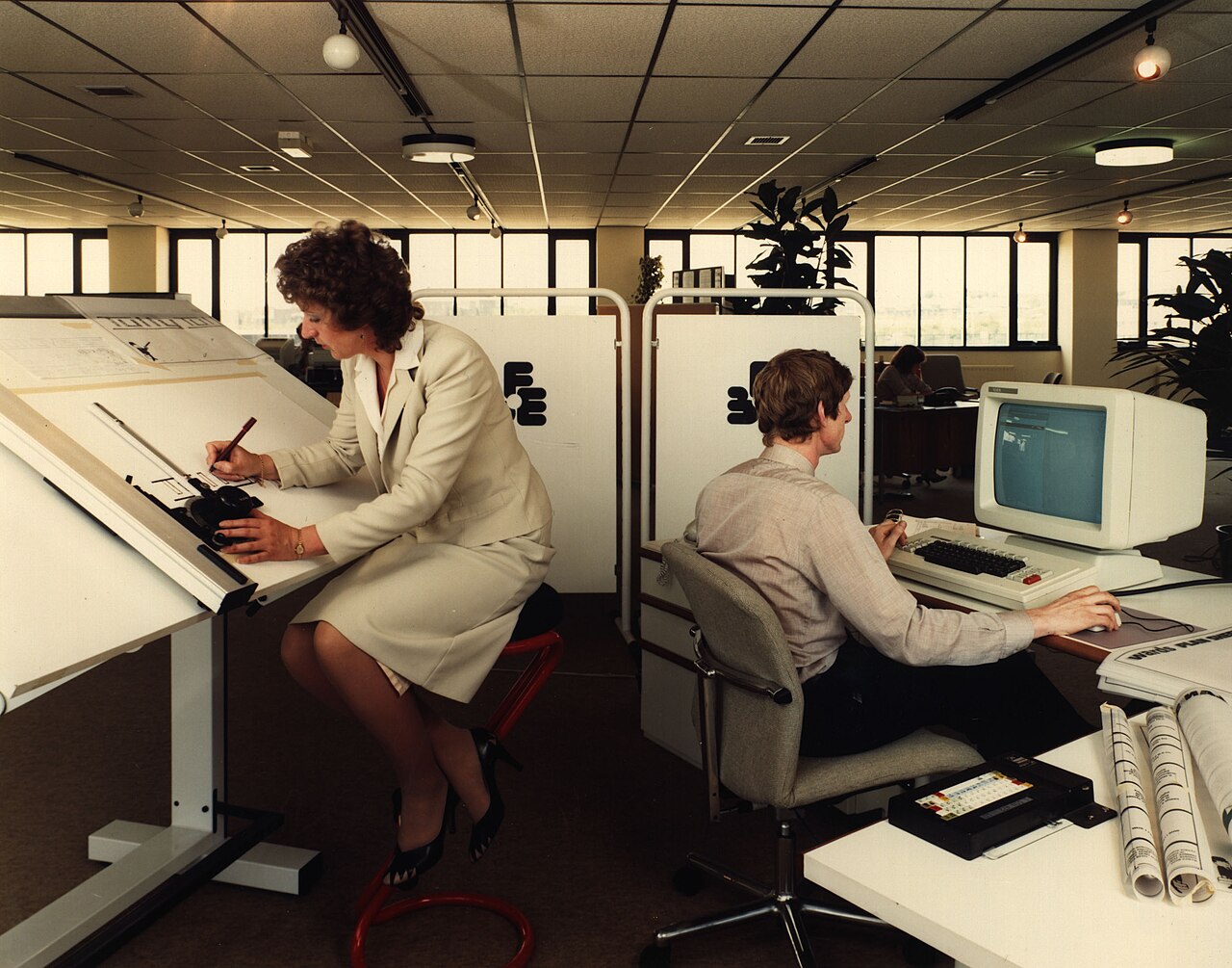 Support team working through the night shift at a bank of desks
